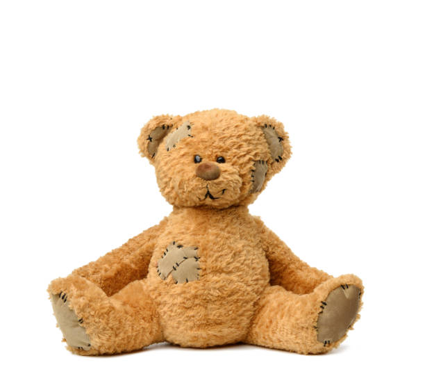 brown teddy bear sits on a white background brown teddy bear sits on a white background, toy with patches behavior teddy bear doll old stock pictures, royalty-free photos & images