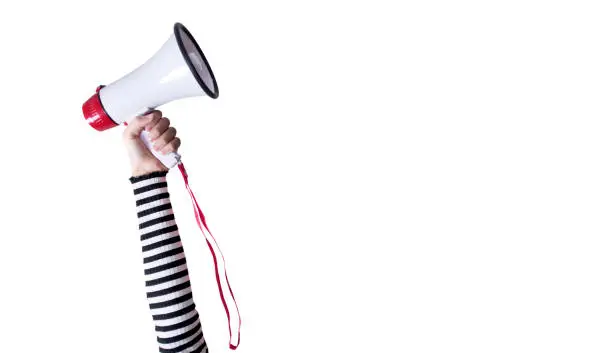 Photo of young woman holding megaphone