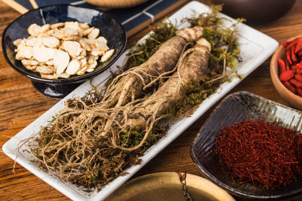 istock Fresh ginseng and dry slices 1294432188