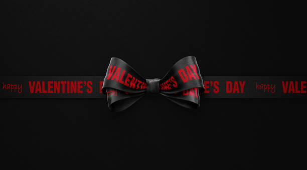 istock Valentine's Day Written Black Ribbon over Black Background 1294433349