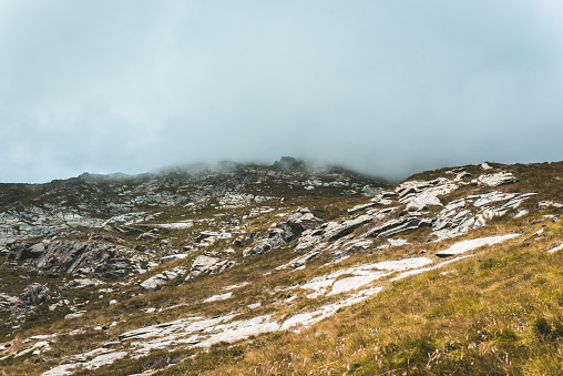 Mountain: Alpine landscape shrouded in fog