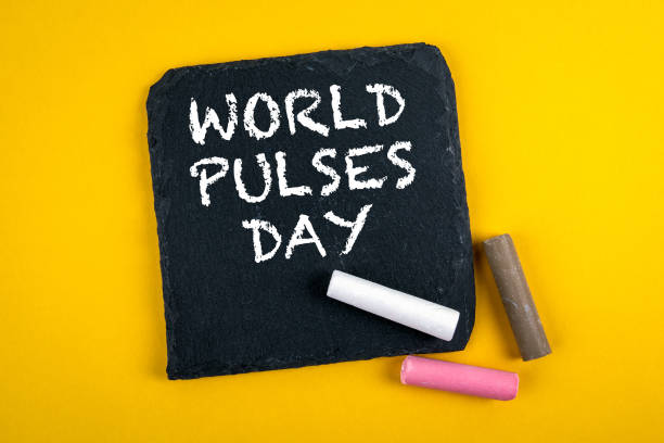 istock World Pulses Day, 10 February. Text on a stone surface 1294435024