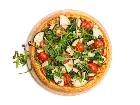 Vegetarian pizza with tofu, eggplant, tomatos, rocket salad, spinach isolated on white