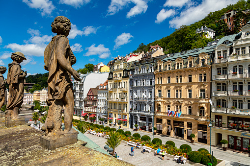 Karlovy Vary, Czech Republic Aug 24, 2019: Elevated view in Karlovy Vary  Down Town Mill Colonnade from the terace with statues - an iconic structure with hot springs-in western Bohemia. Not just the architecture but also the health spas of the city.