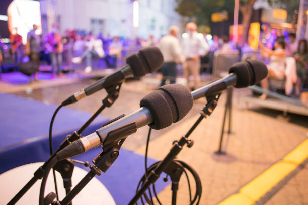 microphones ready for speakers at an event stock photo