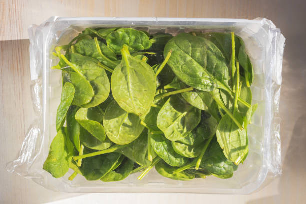 istock fresh baby spinach leaves in a package 1294438664