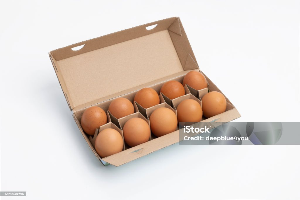 Ten eggs in brown carton on white Brown Stock Photo