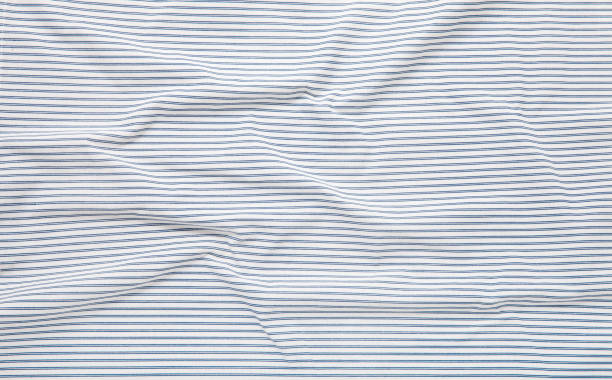 istock White and blue striped fabric texture with creased folds 1294440046
