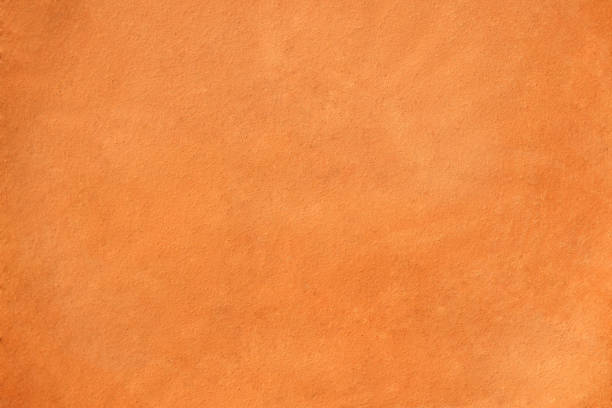 sfondo sfocato di colore arancione dorato - terracotta foto e immagini stock