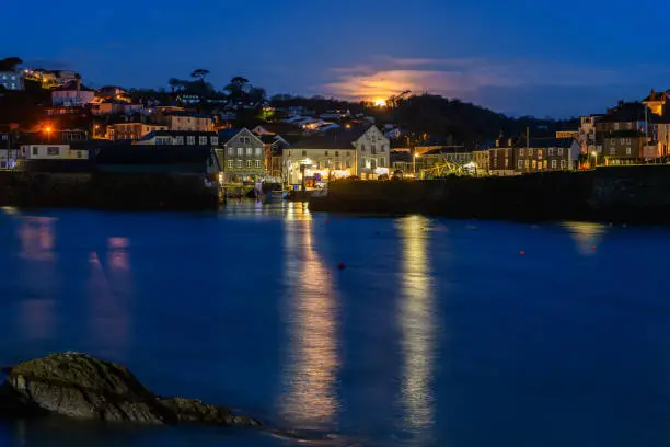 Moon setting over Mevagissey Harbour in Cornwall