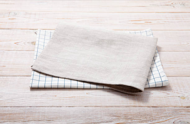 istock Napkin, table cloth on wooden deck mockup. 1294445479