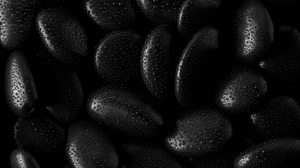 istock Black Stones.rock background and water drop 1294446588
