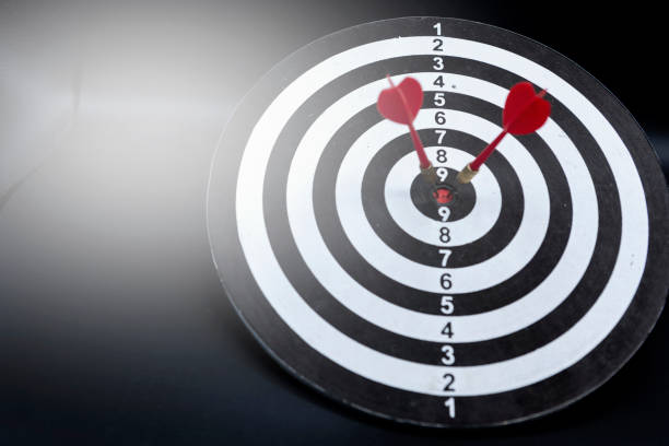 istock Close-up Two dart targets on a black and white background. Concept for success - image 1294446674