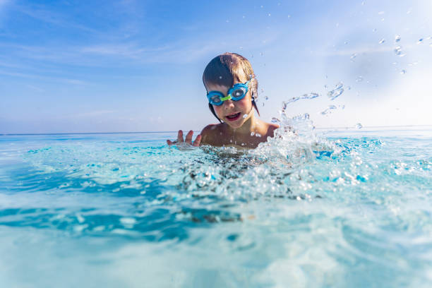 istock Child swimming in the sea 1294448811