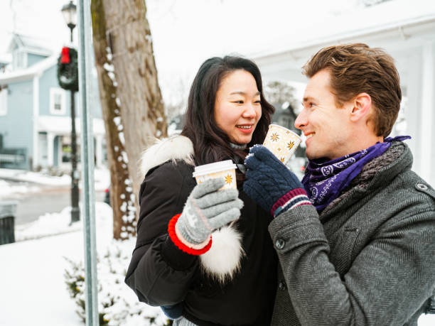 istock Mixed race couple drinking coffee outdoors 1294448840