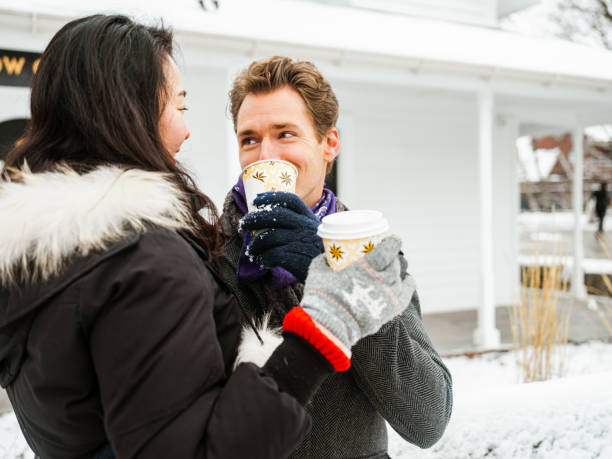 istock Mixed race couple drinking coffee outdoors 1294448849