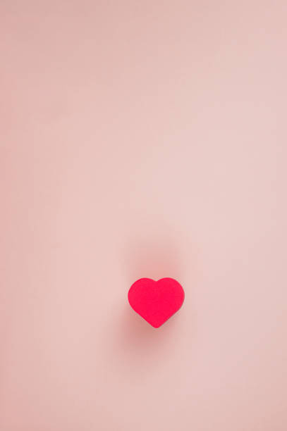 istock one red hearts on a pink background 1294450183