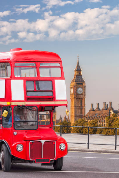 istock Big Ben with old red double decker bus in London, England, UK 1294454376