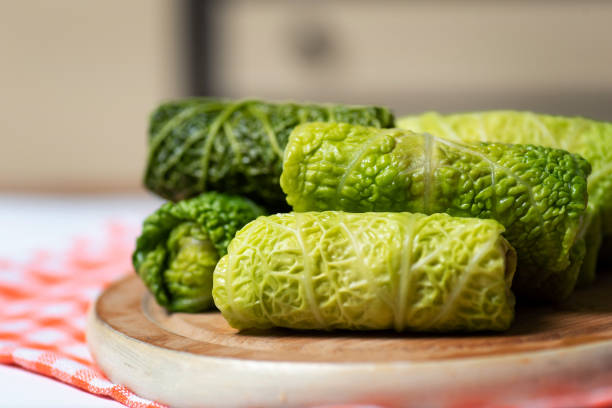 uncooked cabbage rolls called sarma - cauliflower vegetable portion cabbage imagens e fotografias de stock