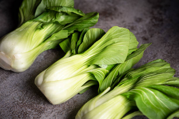 istock Chinese cabbage Bok choy on a rustic background 1294455873