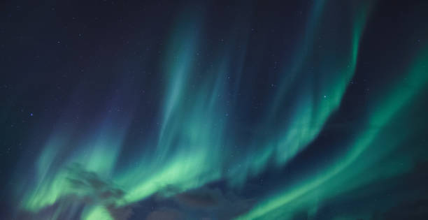 istock Aurora Borealis, Northern Lights glowing in the night sky 1294458388
