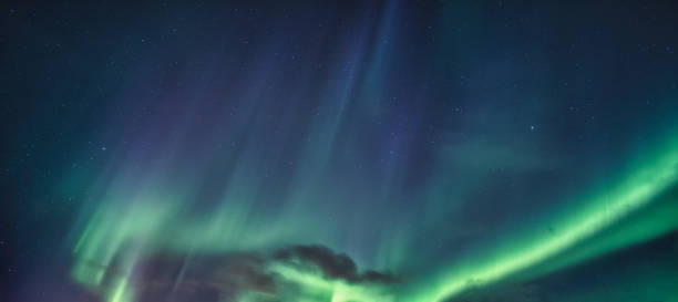 istock Aurora Borealis, Northern Lights glowing in the night sky 1294458405