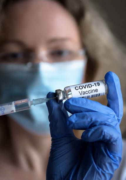 istock COVID-19 vaccine in doctor’s hand closeup 1294461482