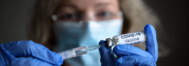 istock COVID-19 vaccine and syringe in doctor’s hands 1294461531