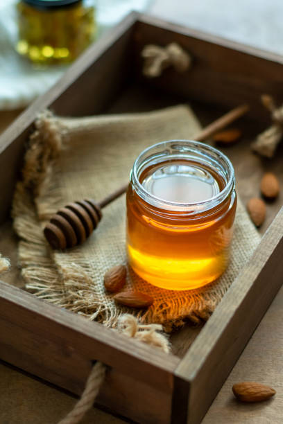istock Small honey dipper with spoon in a wooden box 1294465146