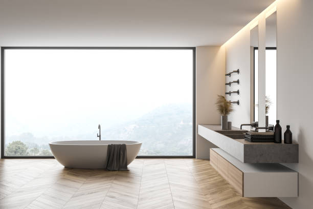 istock Modern white bathroom interior with sink and tub 1294465593
