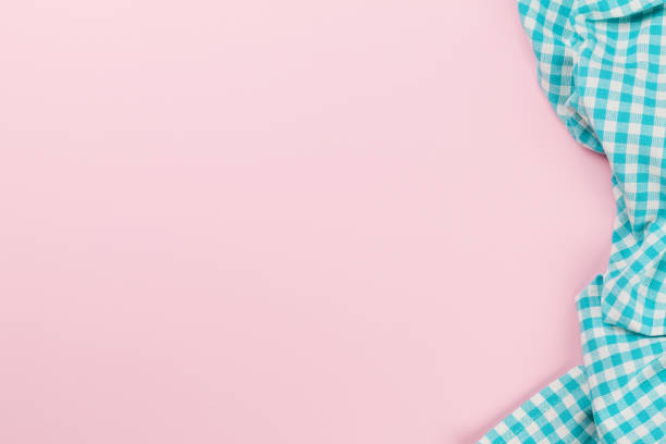 istock Blue kitchen towel on pink background 1294466427