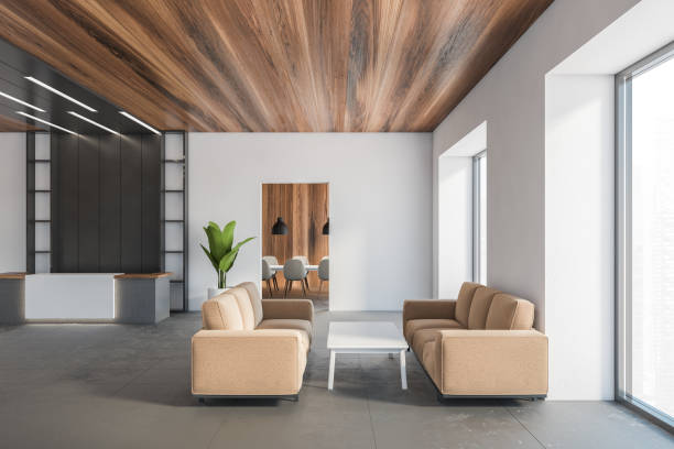 istock Office reception hall with brown sofas and meeting room on background 1294466684