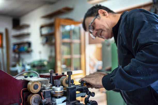 istock Man working at a craft production of leather goods 1294468918
