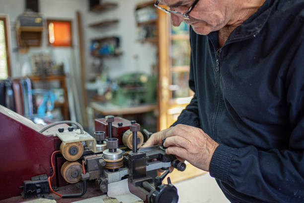 istock Man working at a craft production of leather goods 1294468919