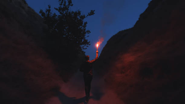 istock The man with a fire stick walking in the mountains 1294468929