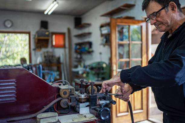 istock Man working at a craft production of leather goods 1294468952
