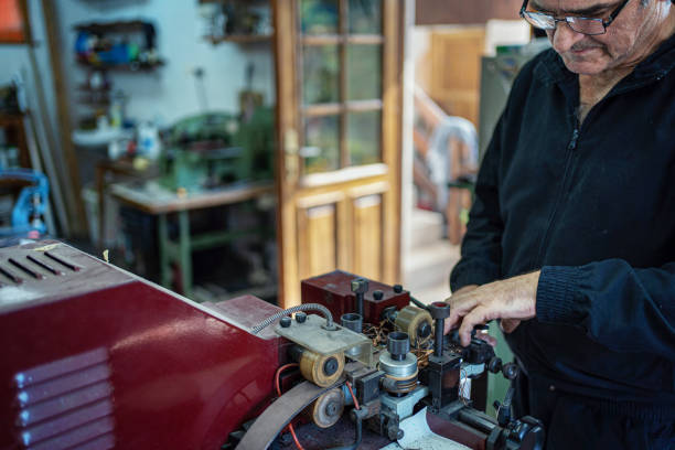 istock Man working at a craft production of leather goods 1294468996