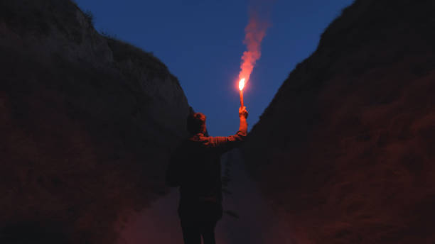 istock The man with a fire stick walking in the mountains 1294469062