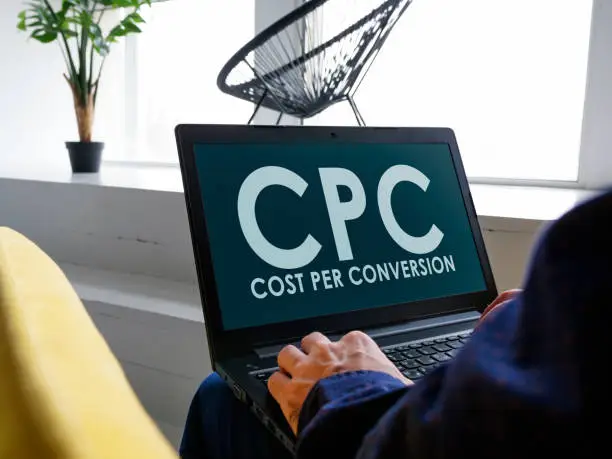 Photo of A man reads about Cost Per Conversion CPC on the internet.
