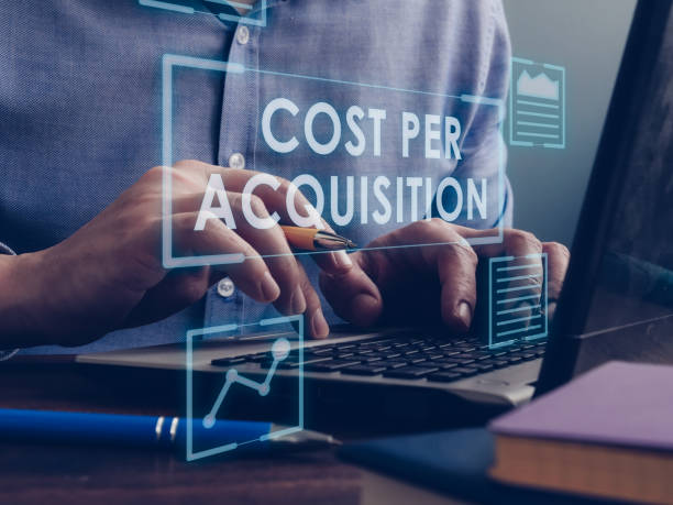 istock Cost Per Acquisition CPA concept. The marketer is working on a laptop. 1294470296