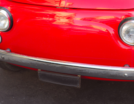 Red Vintage Italian Car with Headlights (Close-Up)