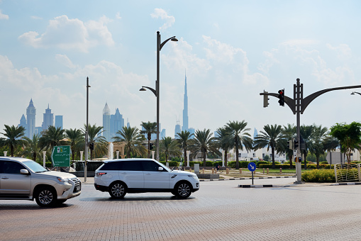 Dubai, UAE - November 16, 2019: The Range Rover Velar and Lexus GX SUVs are on the street of Dubai city.