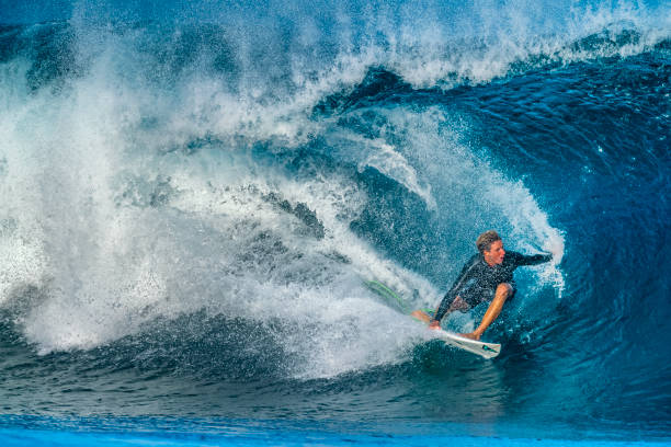 dropknee bodyboarder in a tropical barrel in Puerto Escondido, Mexico.