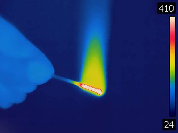Burning fuse with sparks on black background