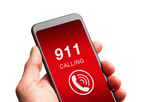 Hand Holding Smart Phone with 911 Call.