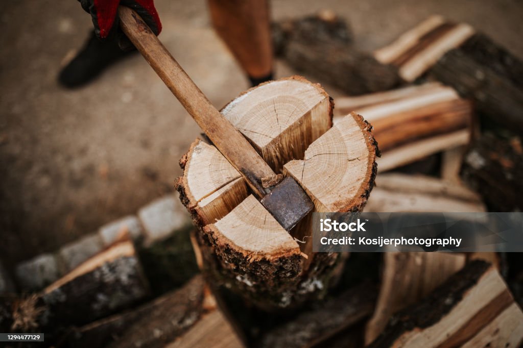 Close up of firewood splitting on four Firewood Stock Photo