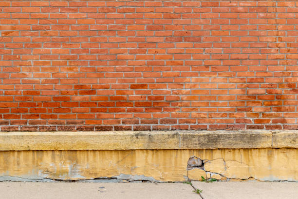 istock Vintage red clay brick wall with grungy weathered appearance 1294482105