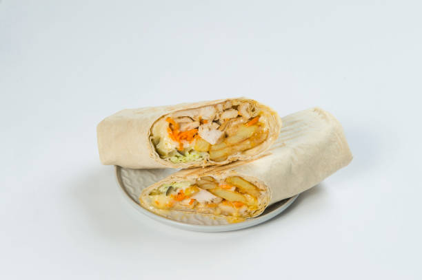 istock Chicken meat Shawarma roll wrapped in lavash bread, isolated on background. Greek Gyros roll. 1294483247