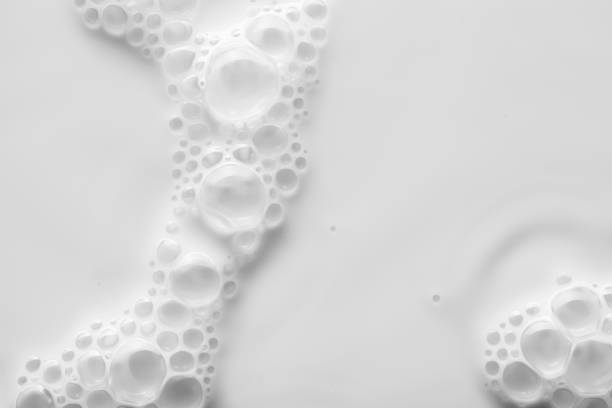 istock Frothy white turquoise green purple pink blue beige clay silky cream mask sample bubble textured foundation isolated on multi-colored background 1294485281
