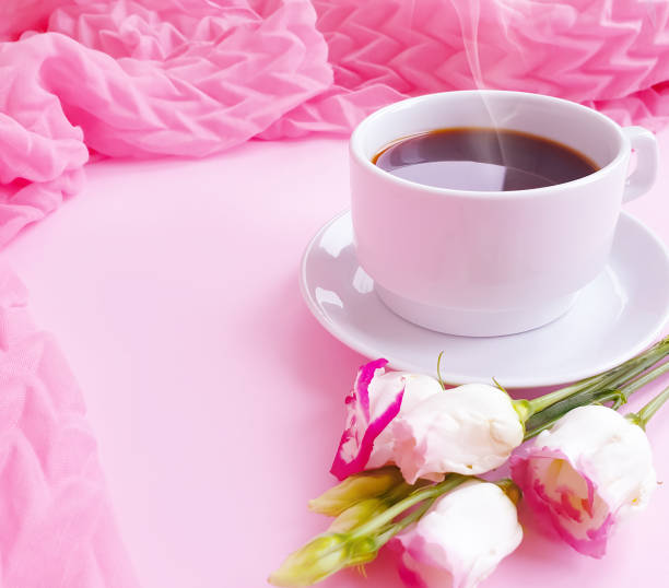 istock cup of coffee flower rose on a colored background 1294485609